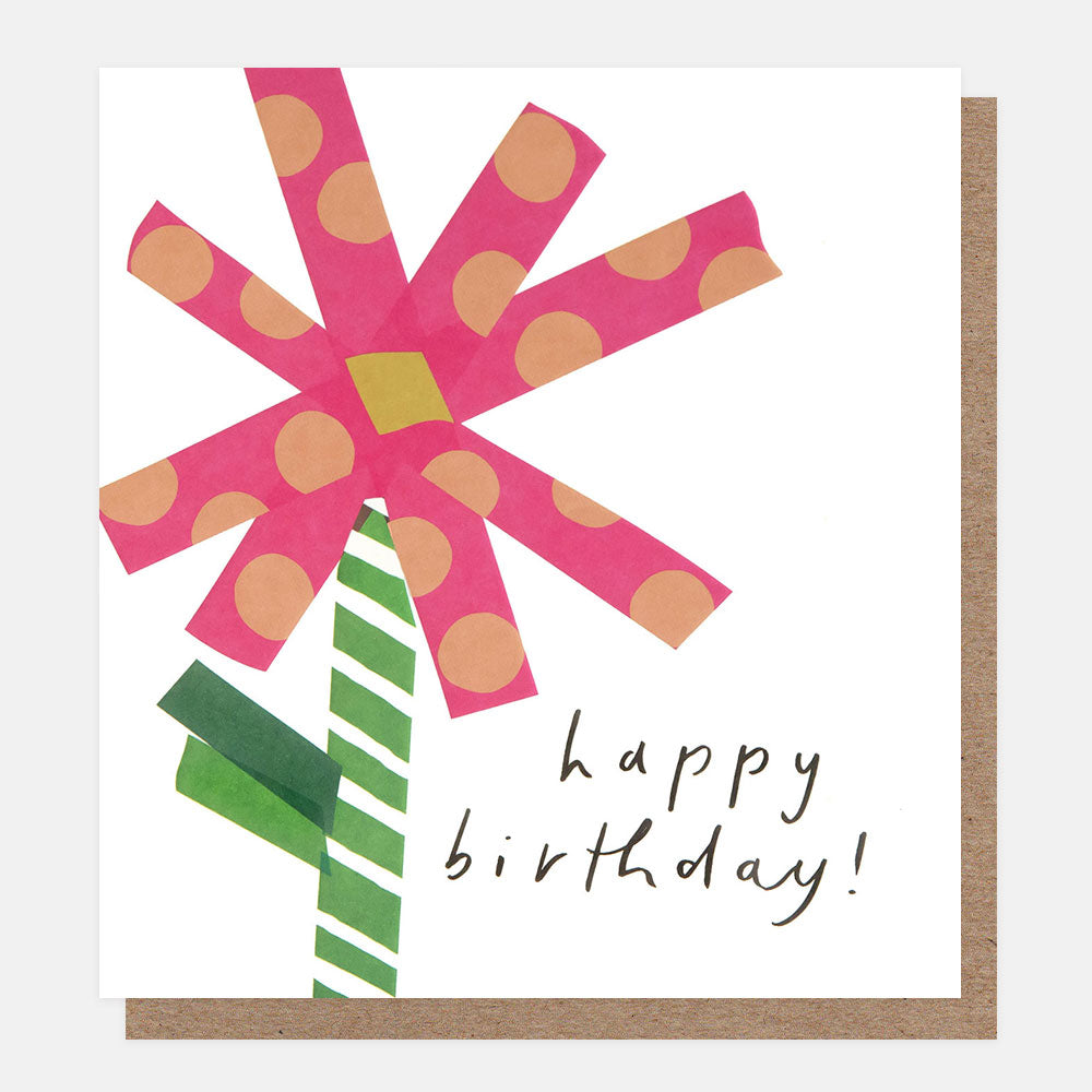 Birthday card with pink polka dot flower, featuring 'Happy Birthday!' text.