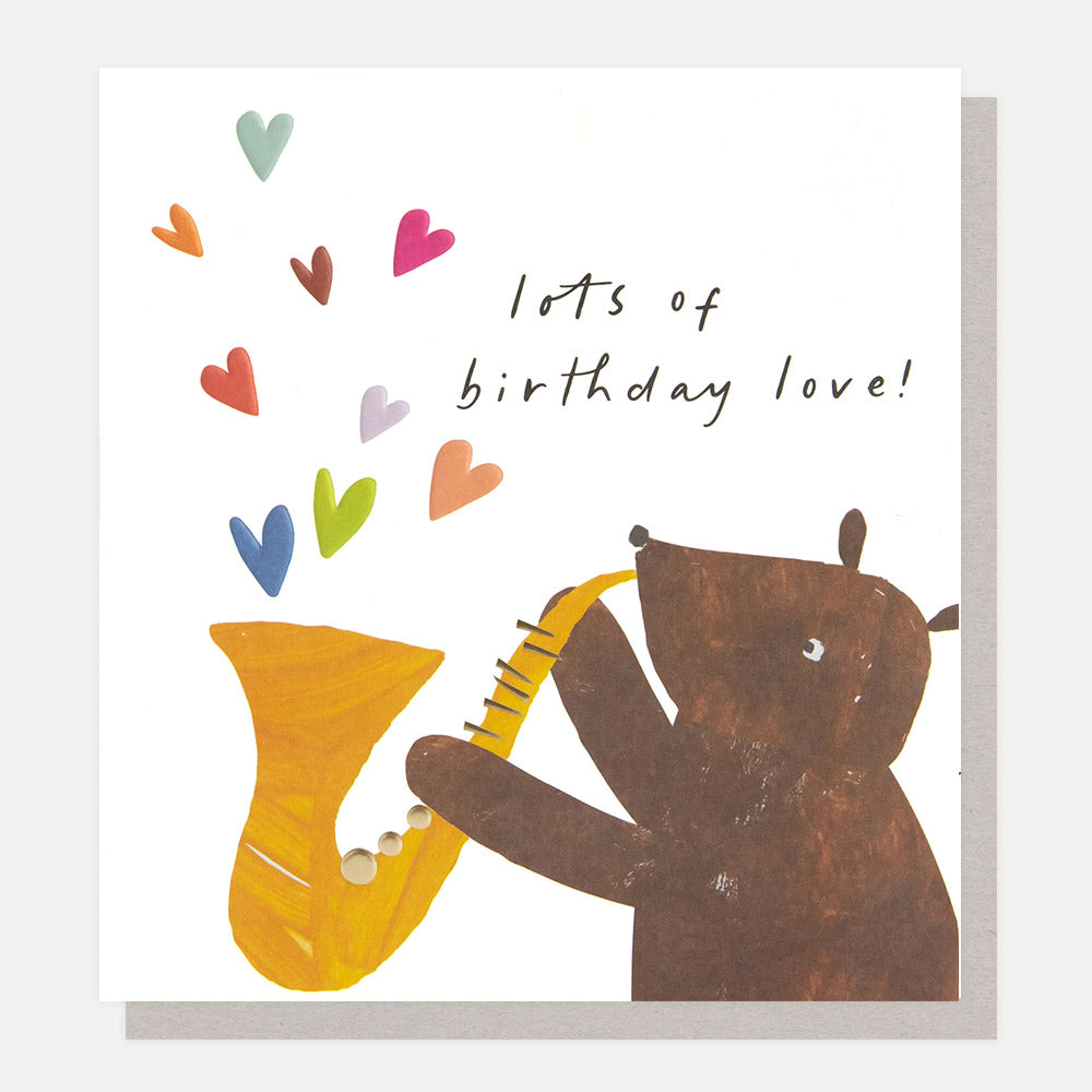 birthday card featuring a brown bear playing a saxophone with colourful hearts coming out and the wording lots of birthday love