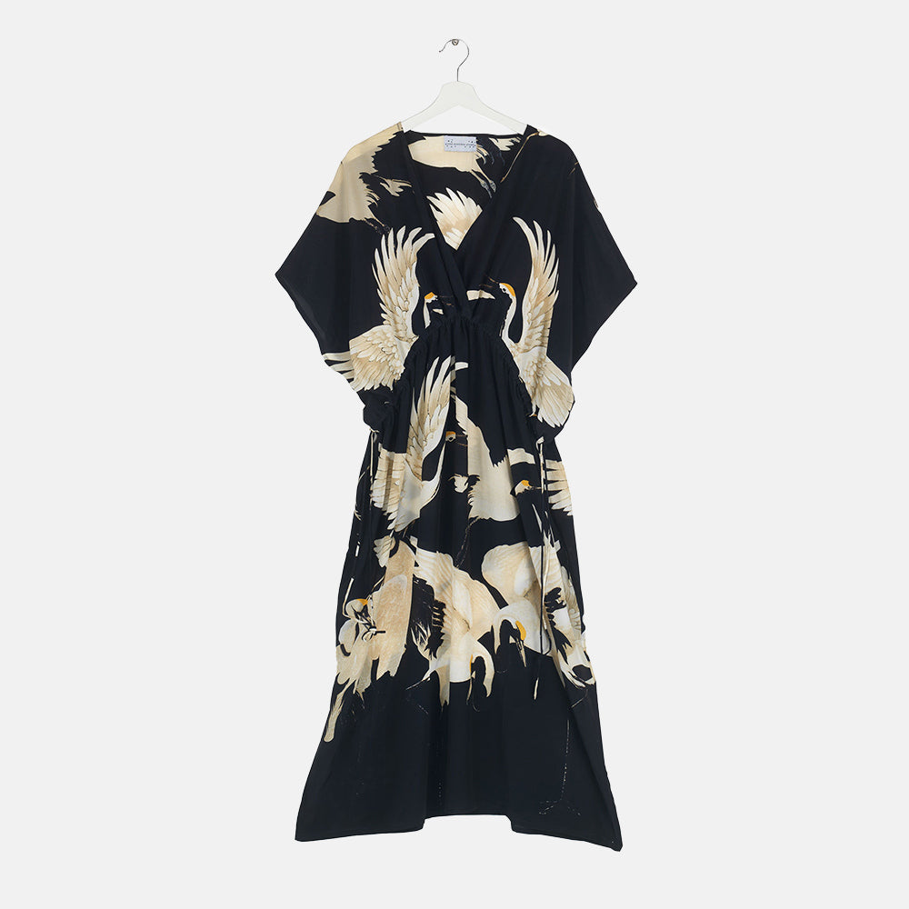 women's drawstring dress featuring white cranes on a black base, made by One Hundred Stars