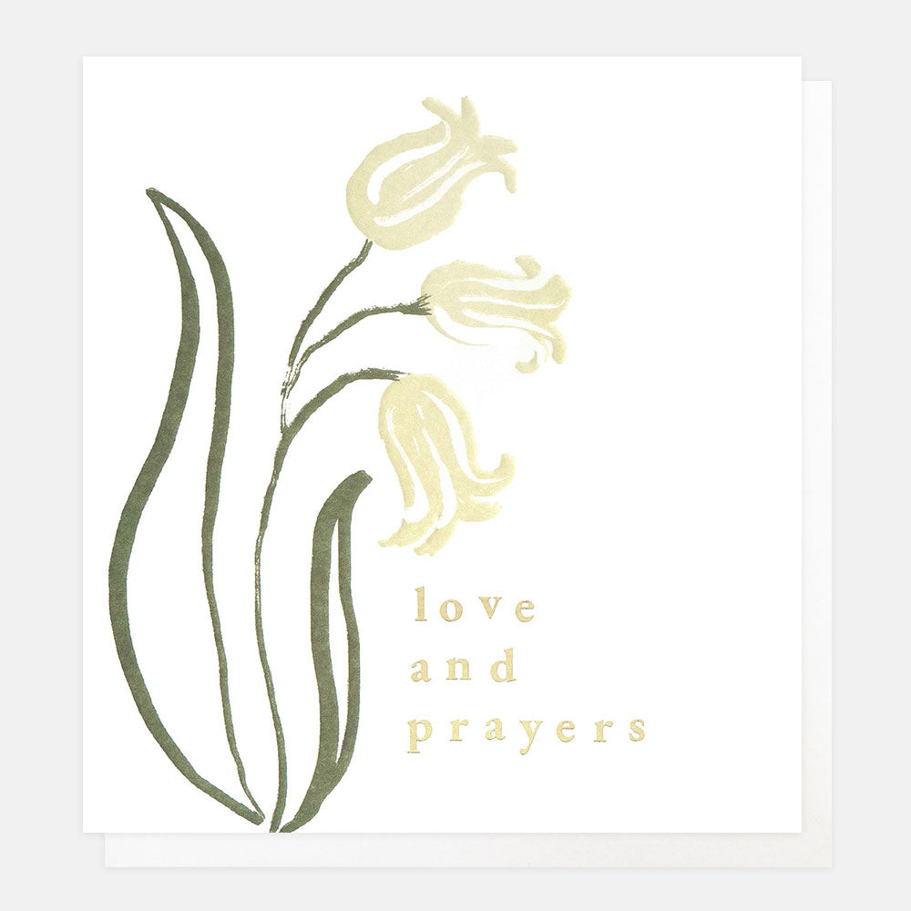 sympathy card with a design of hand drawn white flowers and the text 'love and prayers'
