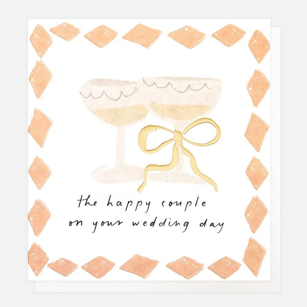 wedding card featuring 2 champagne glasses with a bow and diamond boarder and the words the happy couple on your wedding day