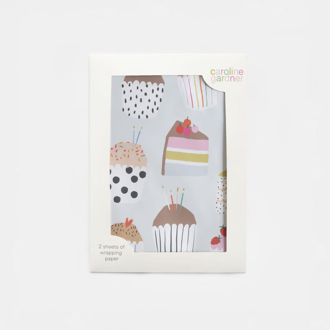 set of 2 sheets of wrapping paper featuring multi coloured slices of cake and cupcakes with candles