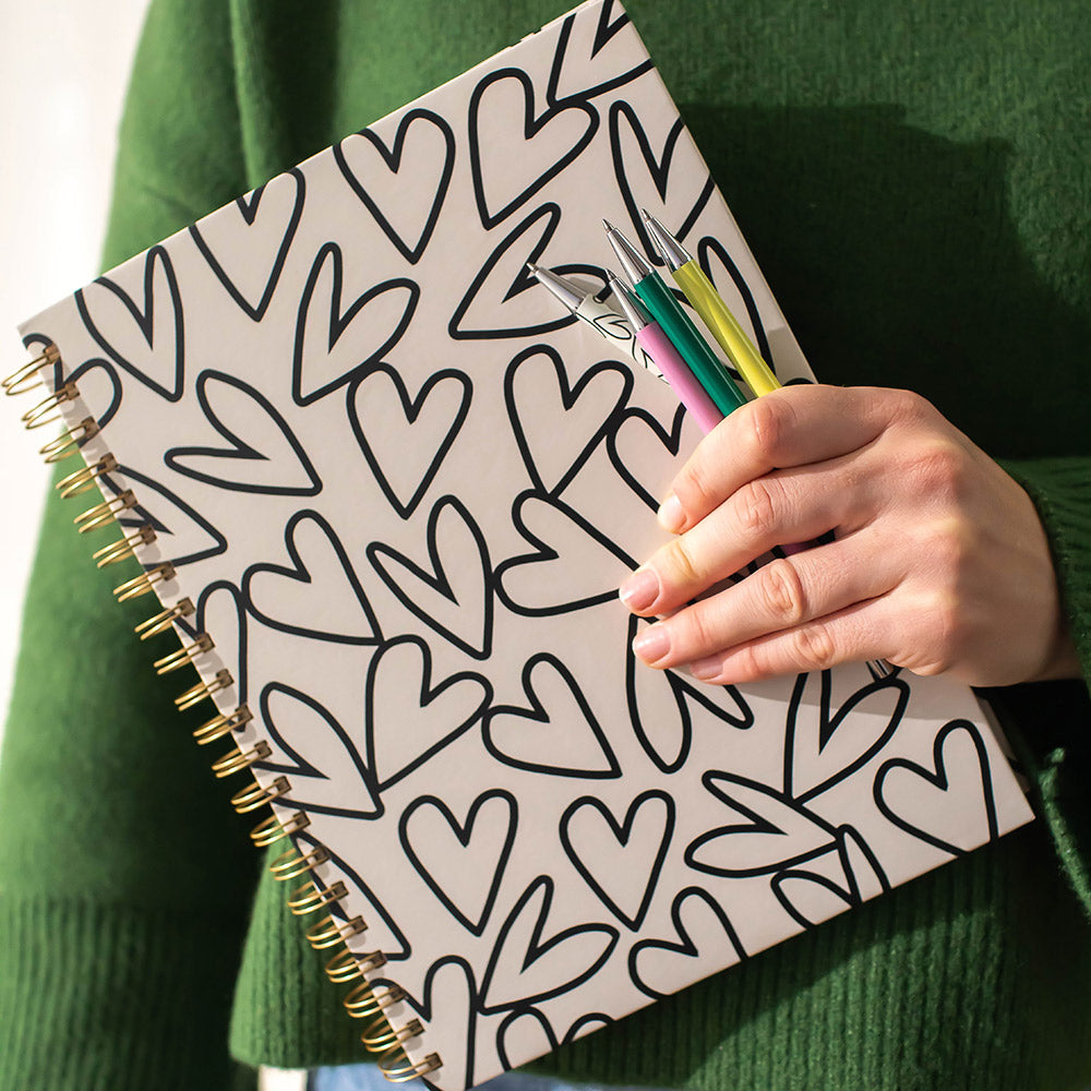 monochrome hearts print notebooks & colourful pens