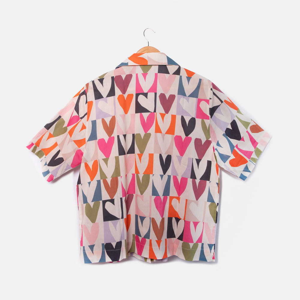 back of short sleeved pyjama shirt and in bright colourful grid hearts design