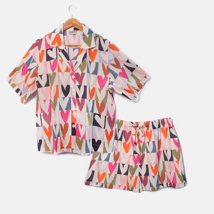 short sleeve pyjama shirt and shorts set in bright colourful grid hearts design