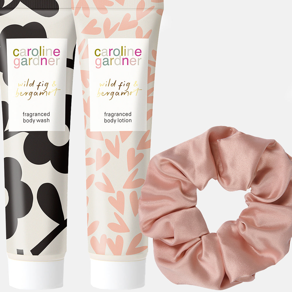 caroline gardner wild fig & bergamot body lotion & body wash and a pink scrunchy. 