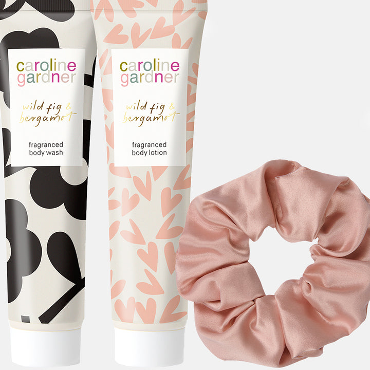 caroline gardner wild fig & bergamot body lotion & body wash and a pink scrunchy. 