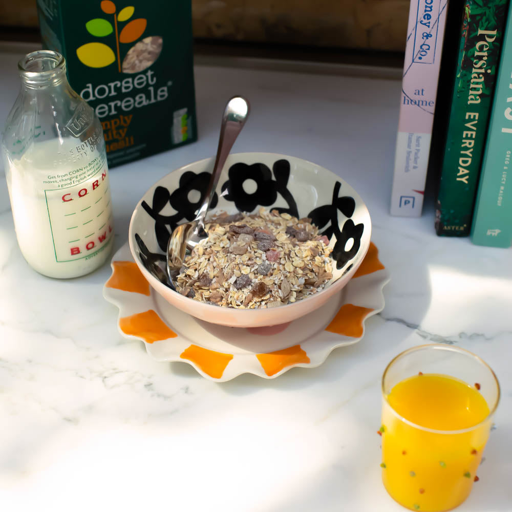 ceramic stoneware cereal bowl with pink outer and monochrome flower design inside