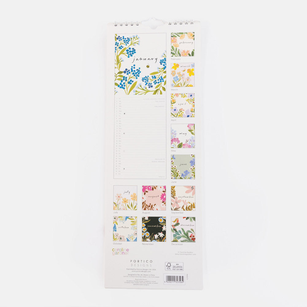A vertical white spiral-bound calendar page set with floral illustrations and small decorative panels, photographed against a plain white background.
