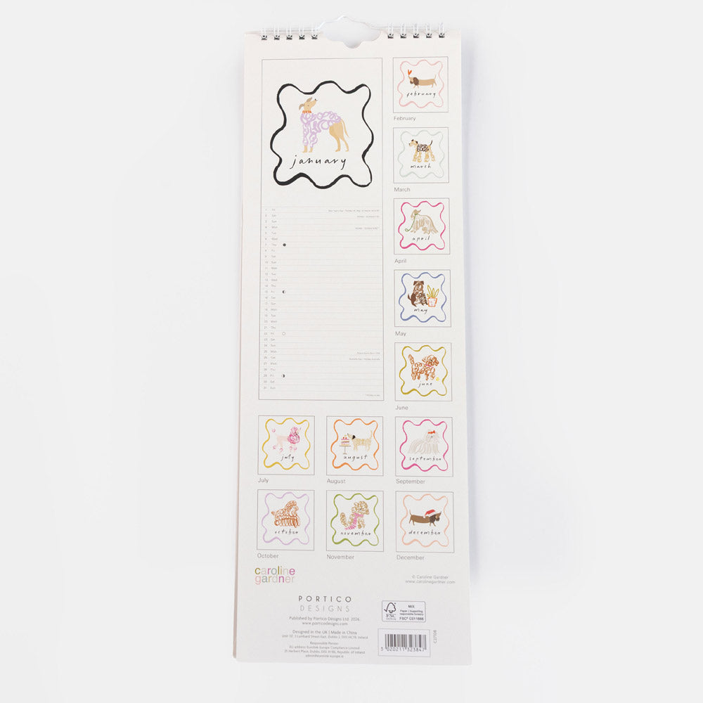 A vertical hanging paper calendar page with lined daily writing space and small decorative dog-themed label stickers shown along the right side. The page has a white background and visible printed branding near the bottom reading Colorful Calendars and Portico.