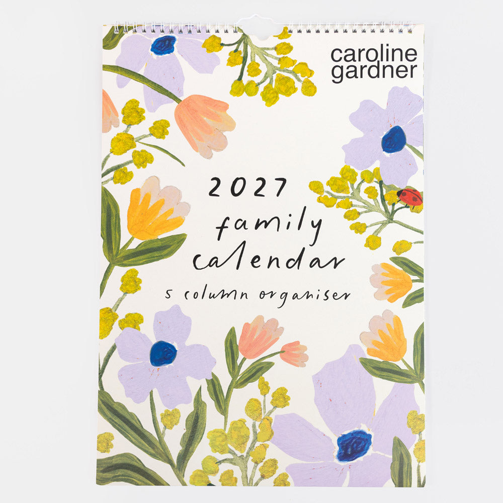 A 2027 family calendar by Caroline Gardner, featuring a white cover decorated with a colorful watercolor floral border and black text.