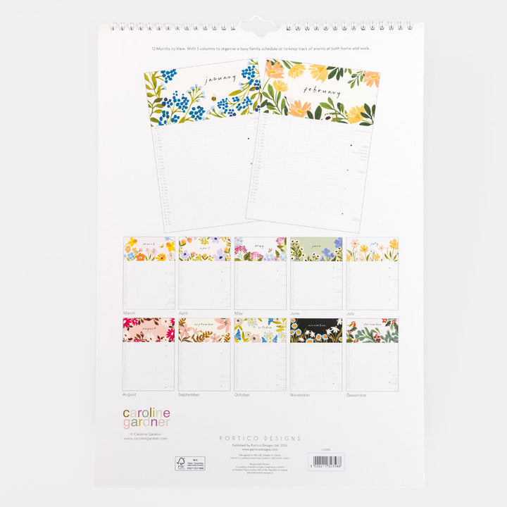 A spiral-bound floral calendar page from Portico Designs Caroline Garner, showing the front cover with a large floral header and multiple smaller monthly inserts below, photographed on a light gray background.
