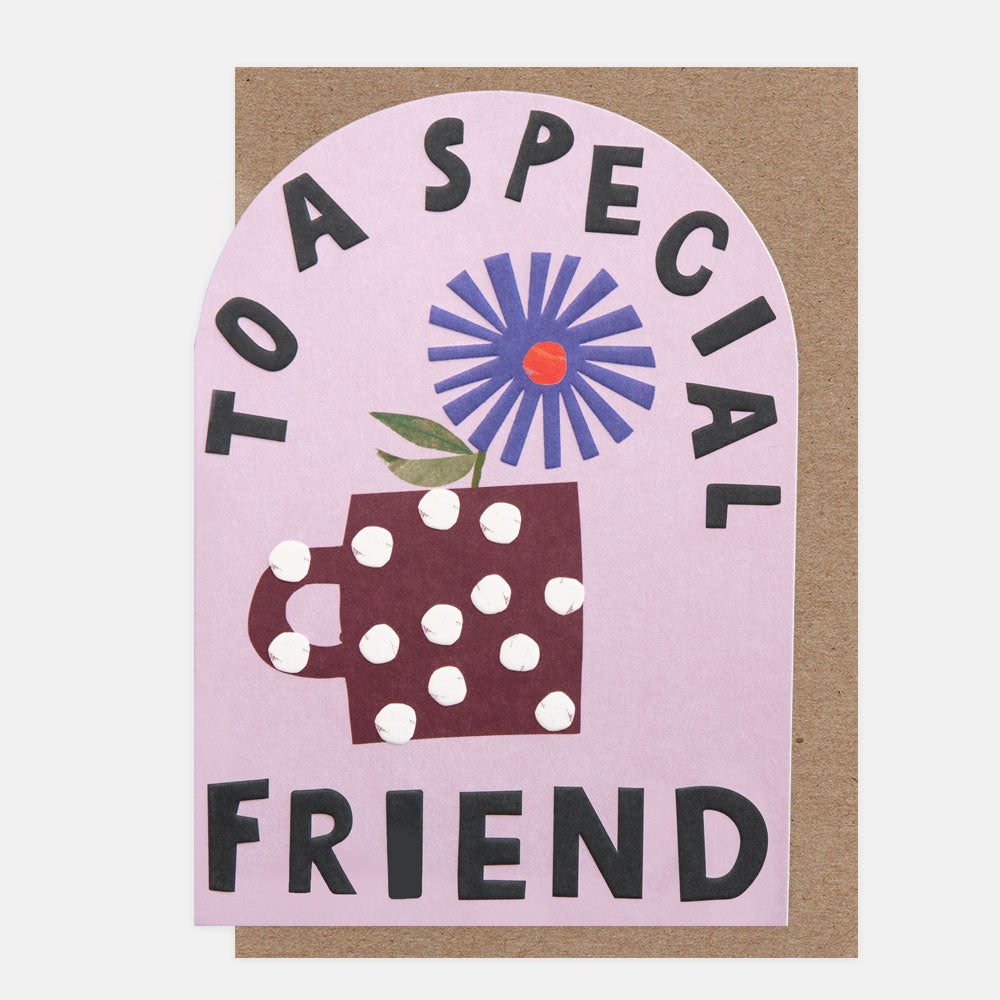 greetings card with a curved top featuring a blue flower in a spotty brown mug and the words 'to a special friend' in bold black text