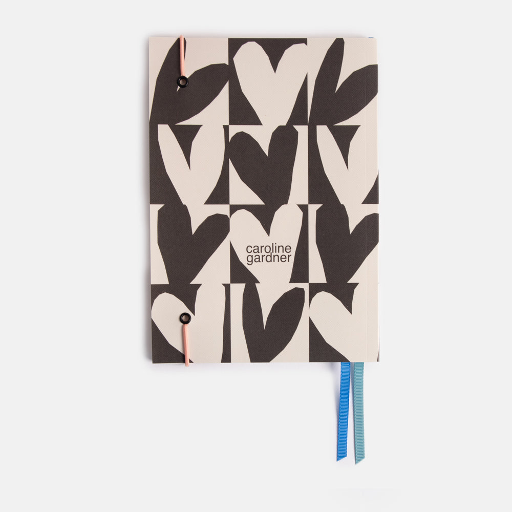 soft cover a5 lined notebook with monochrome checked hearts print design