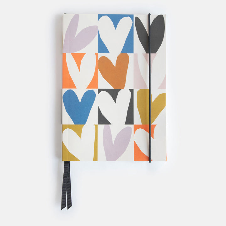 A5 softcover notebook with a multicolour hearts print, black ribbon page markers and elastic closure band