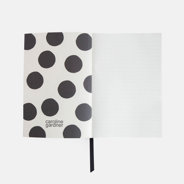 A5 softback notebook with a big spot inner print and lined pages