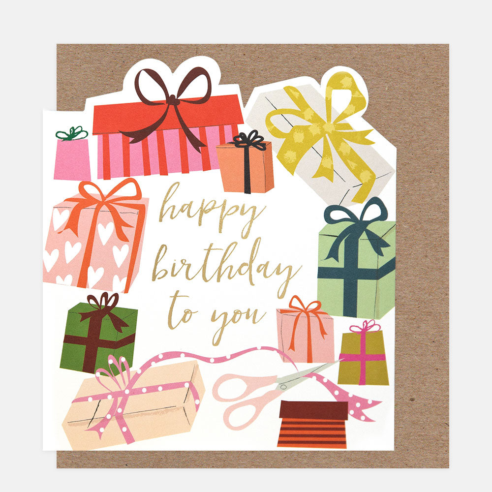 Birthday card with colorful gift boxes and scissors on a white background
