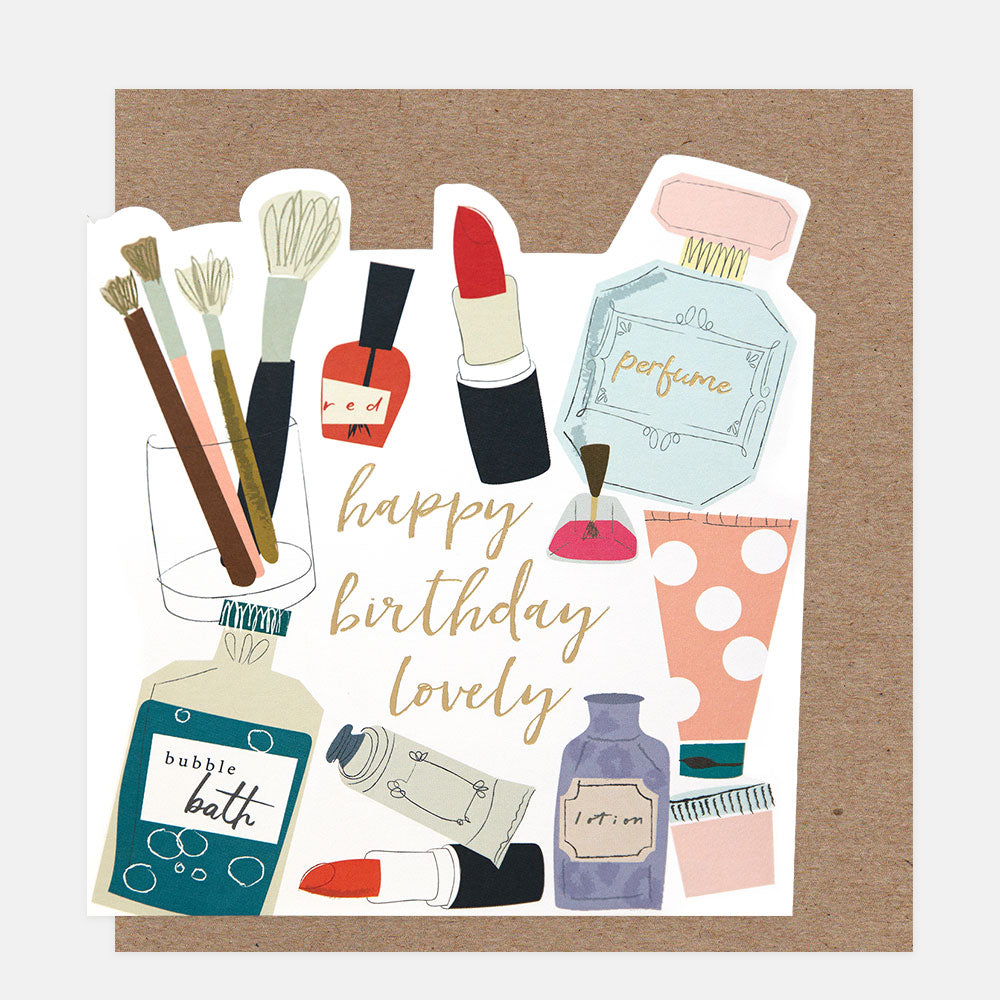 Illustrated birthday card with cosmetic items and 'happy birthday lovely' text on a brown background.