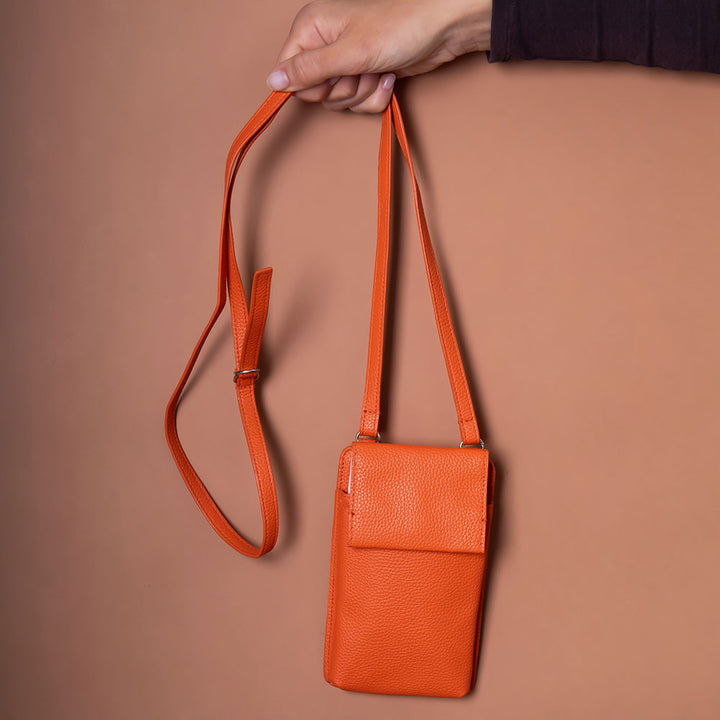 orange leather look phone bag with front flap pocket & 3 card slots on the back