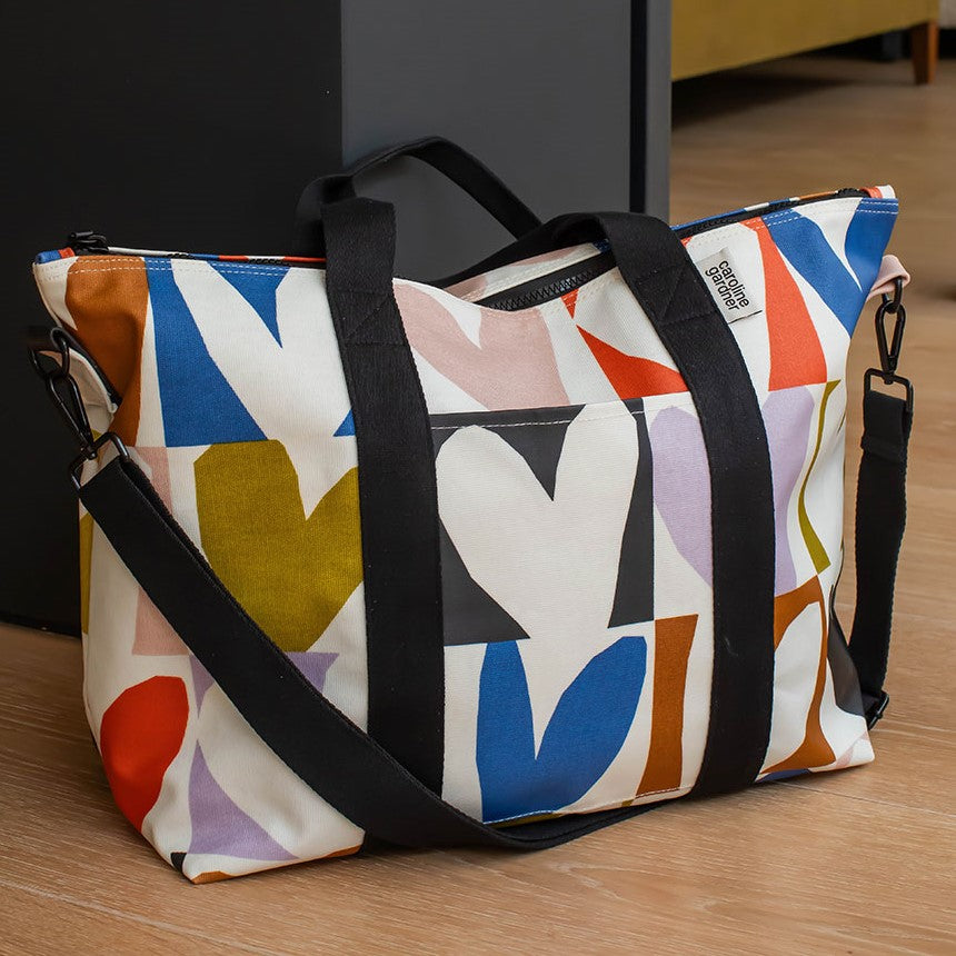 colourful hearts print weekend bag with black straps