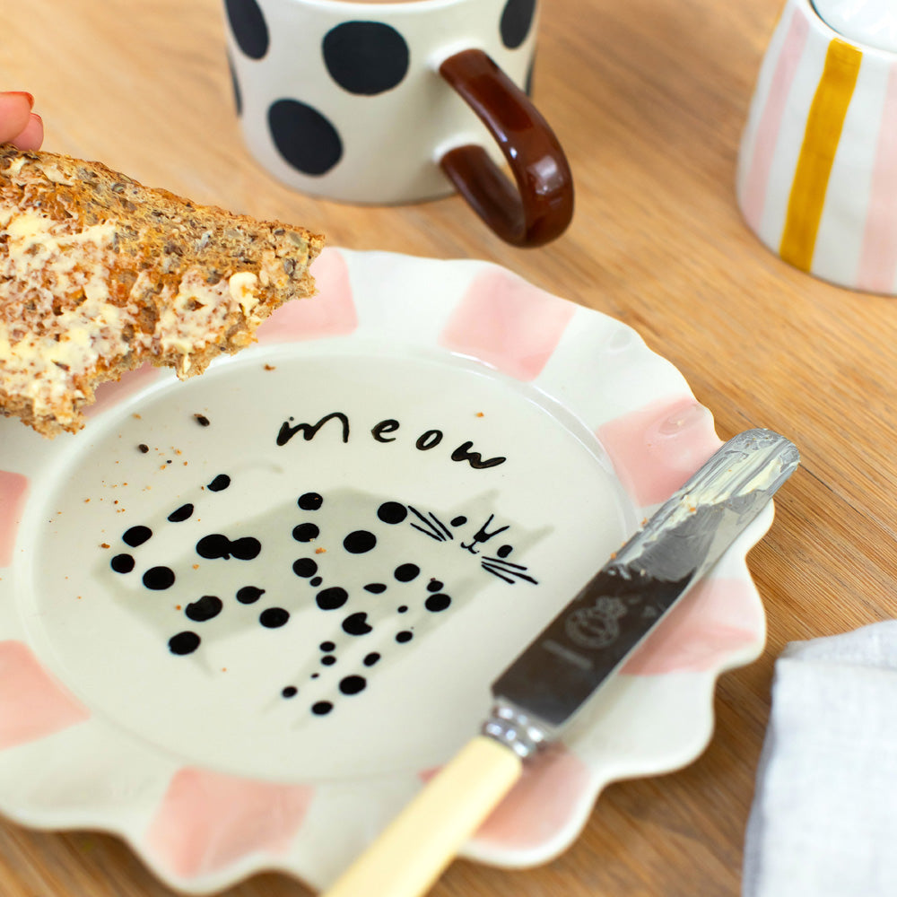 hand painted ceramic stoneware plate with soft pink stripe scalloped edge, spotty cat design and 'meow' slogan
