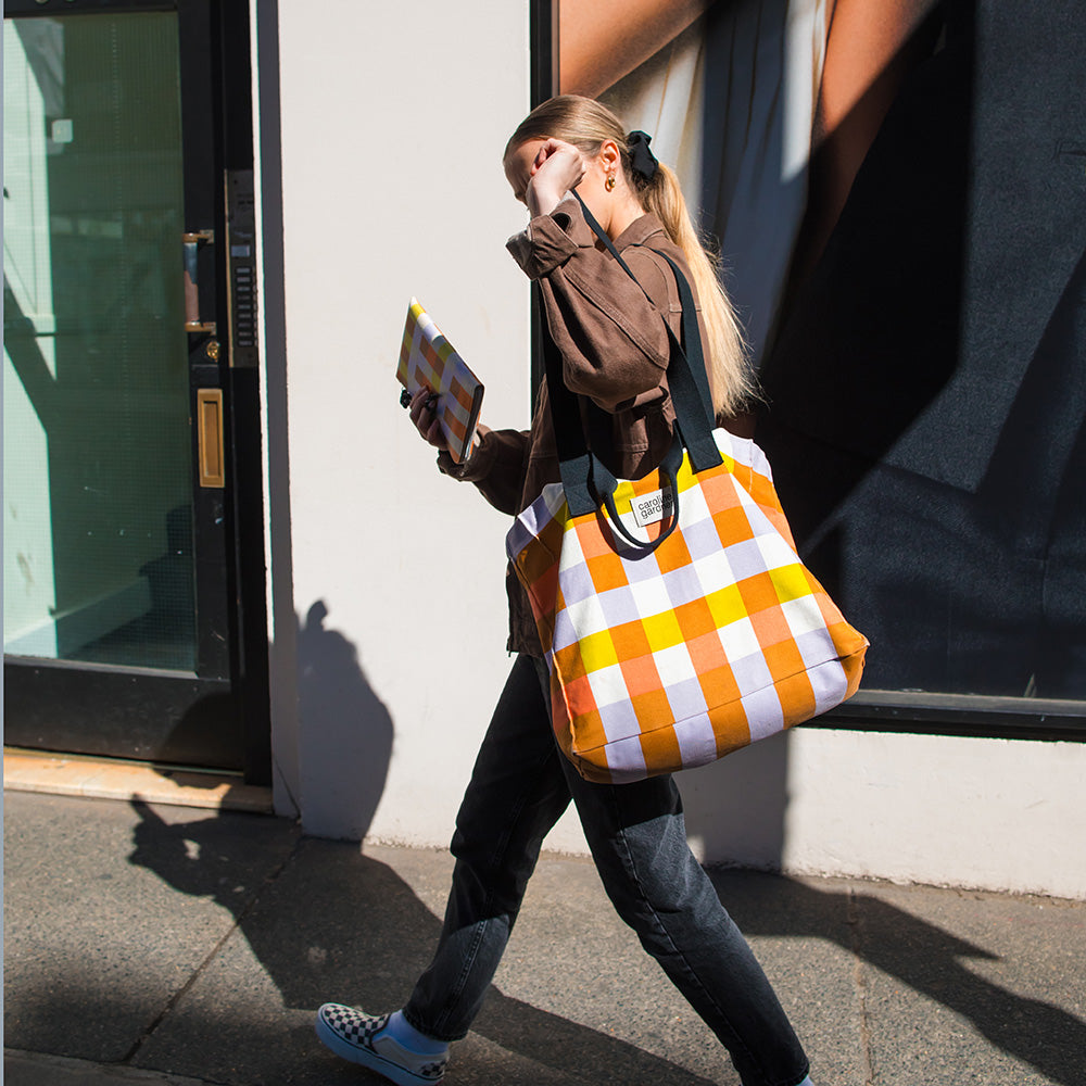 large cotton canvas tote or shopper bag in multi coloured check print with grab and shoulder straps
