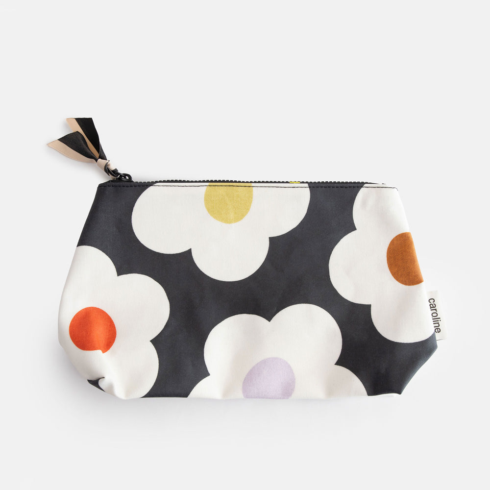 coated cotton beauty clutch bag in colourful flowers on charcoal design, with zip closure and grosgrain zip pull