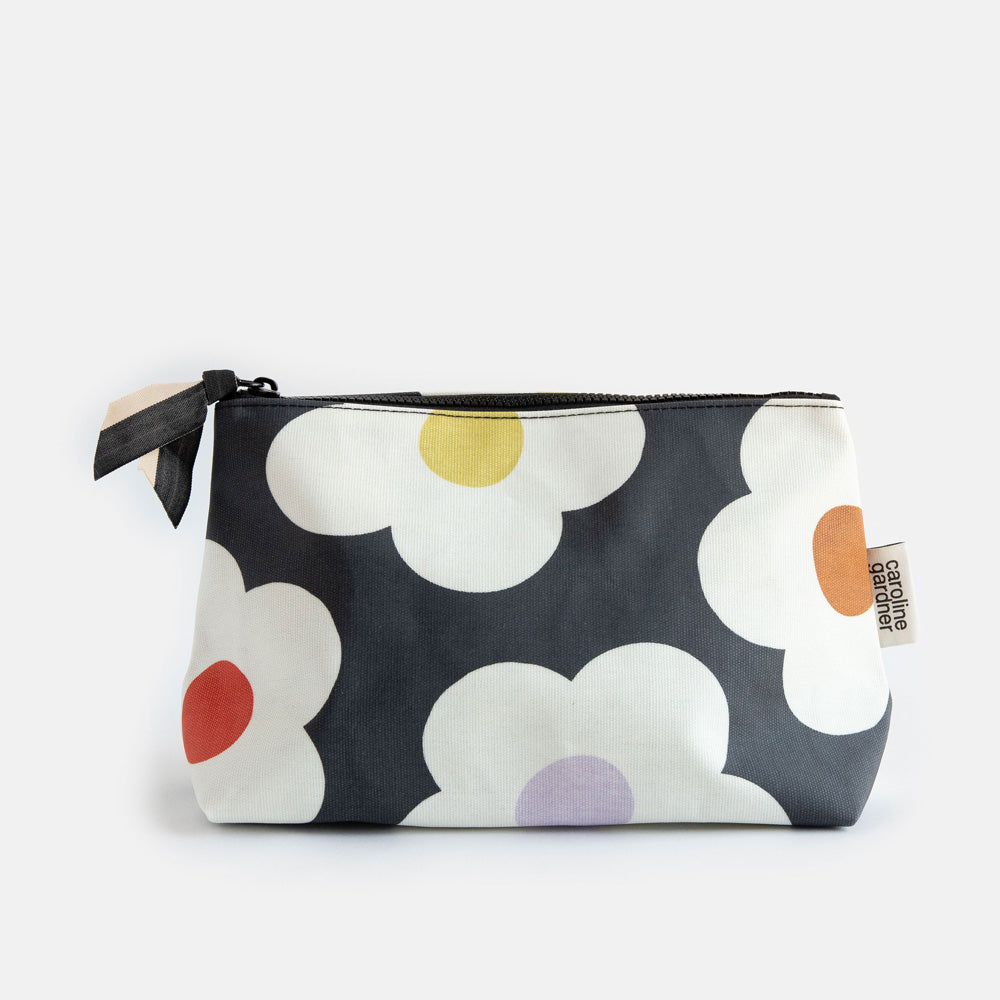 coated cotton beauty clutch bag in colourful flowers on charcoal design, with zip closure and grosgrain zip pull
