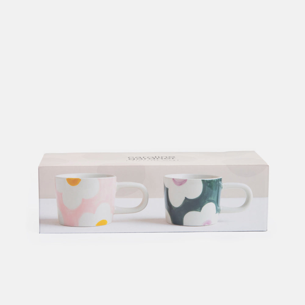 Two espresso cups with floral patterns in a 'caroline gardner' branded box on a white background