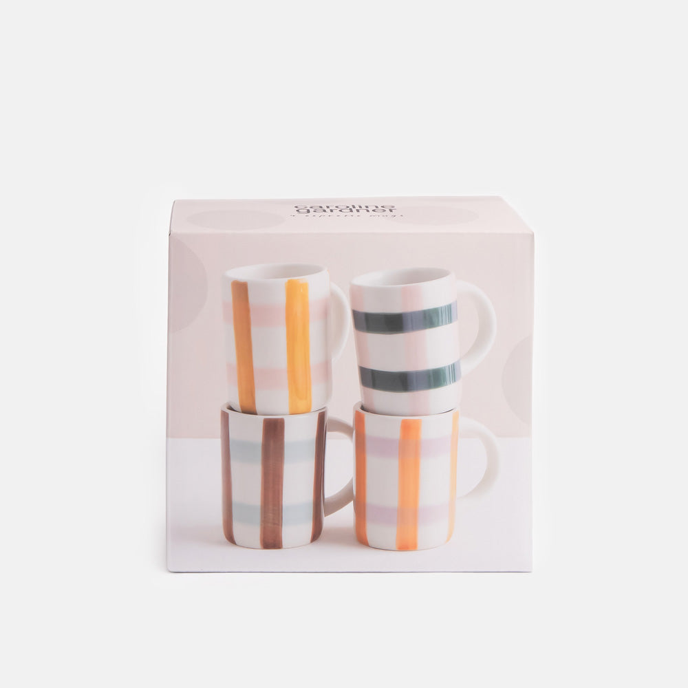 Boxed set of four espresso cups with colourful checked patterns on a white background