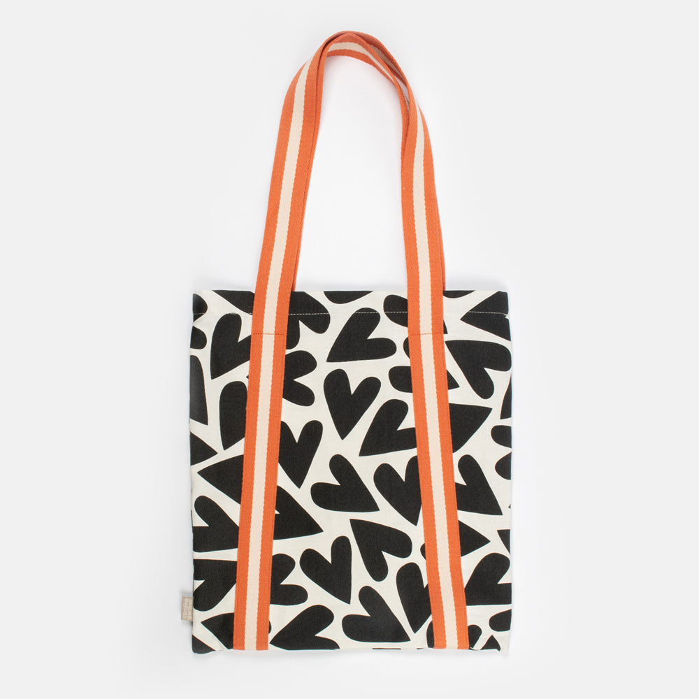 black and white monochrome hearts cotton canvas tote bag with contrast orange webbing straps