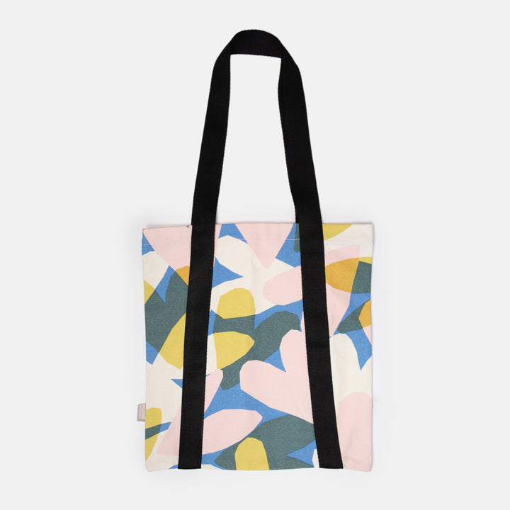 hand printed cotton canvas tote bag with colourful confetti hearts print design and black webbing handles