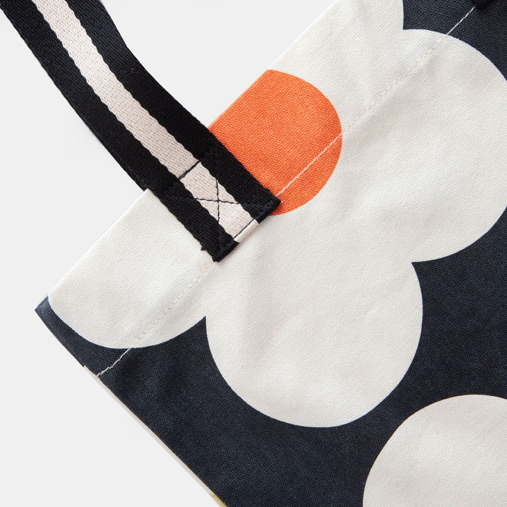 hand printed cotton canvas tote bag with colourful flowers on charcoal design and monochrome stripe webbing handles