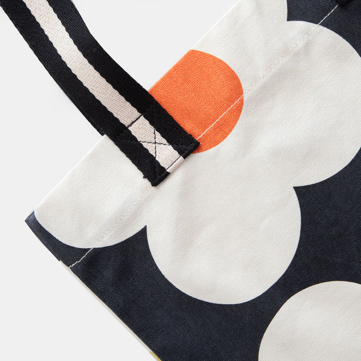 hand printed cotton canvas tote bag with colourful flowers on charcoal design and monochrome stripe webbing handles