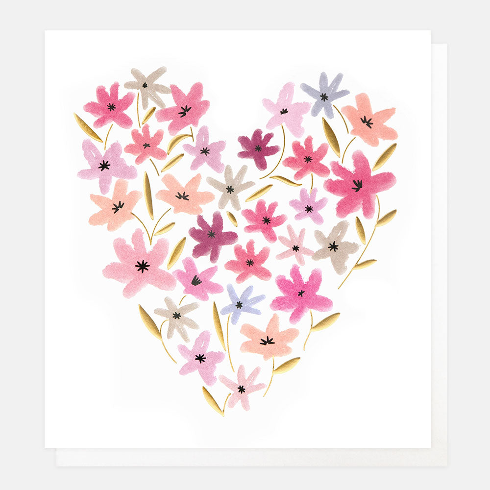 greetings card featuring pastel coloured flowers arrange in a heart shape of a white background