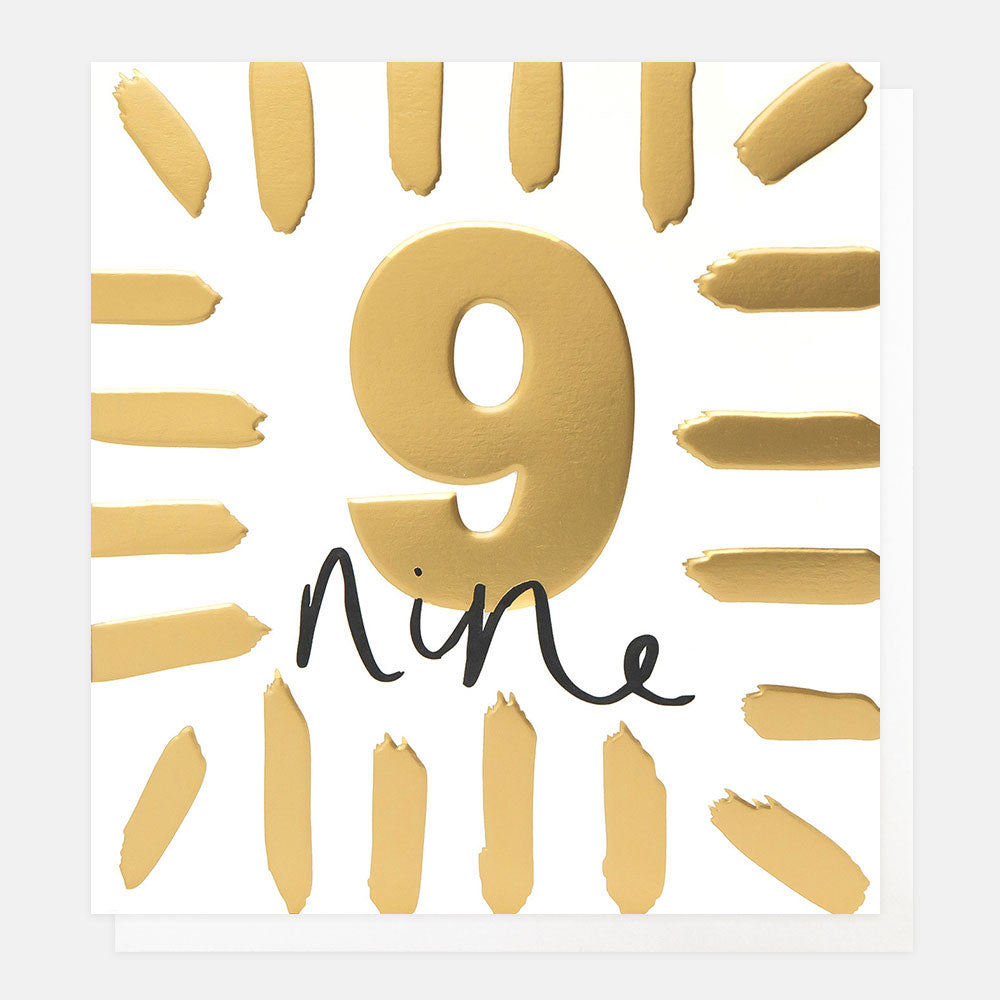 birthday card featuring the number 9 in gold foil and the word 'nine' in black handwritten style lettering
