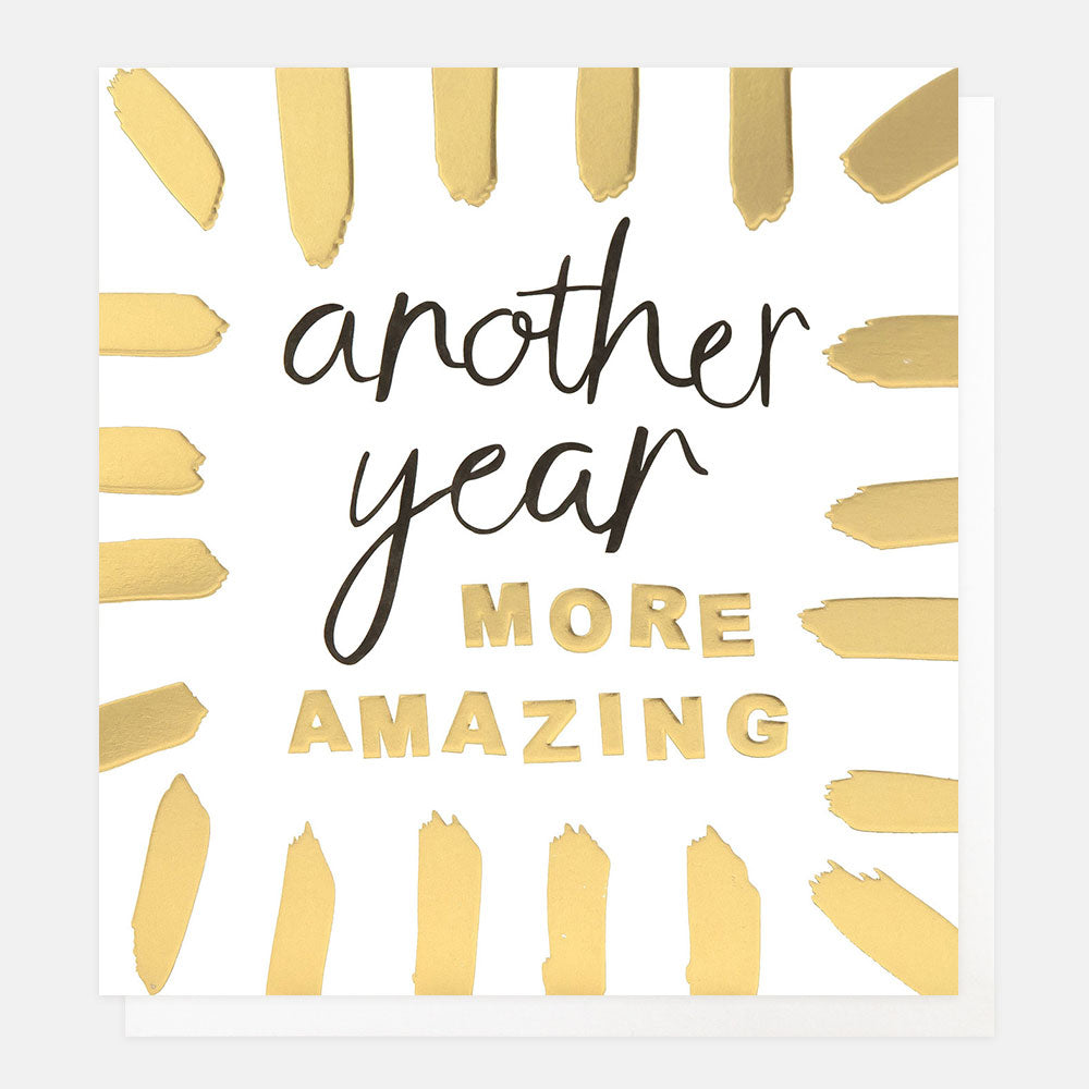 birthday card featuring a border of gold brushstrokes and the message 'another year more amazing'
