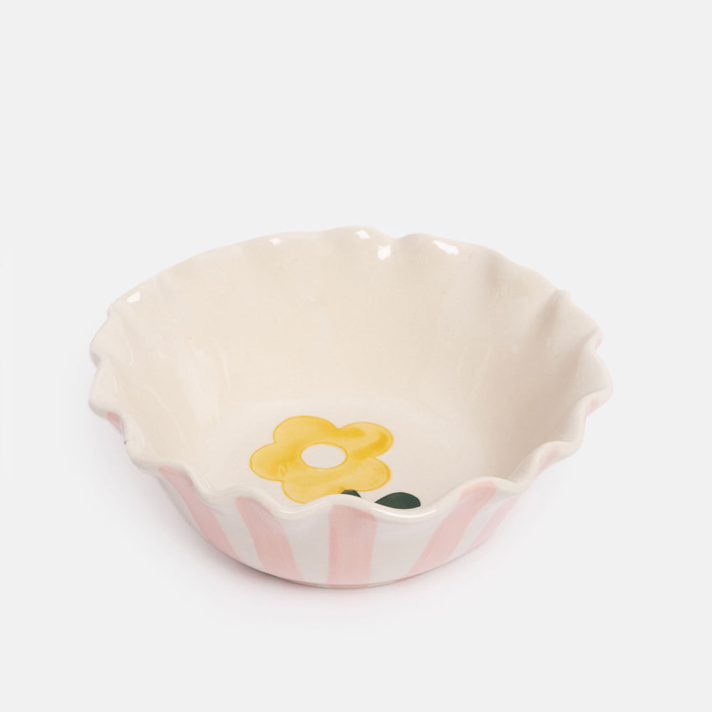 pink scalloped edge glazed stoneware cereal bowl with yellow flower design inside