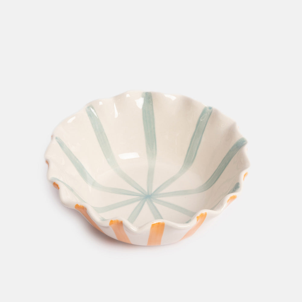Ceramic bowl with orange stripes on the exterior, blue stripes on the interior, and a scalloped edge
