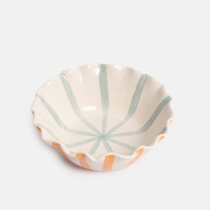 Ceramic bowl with orange stripes on the exterior, blue stripes on the interior, and a scalloped edge