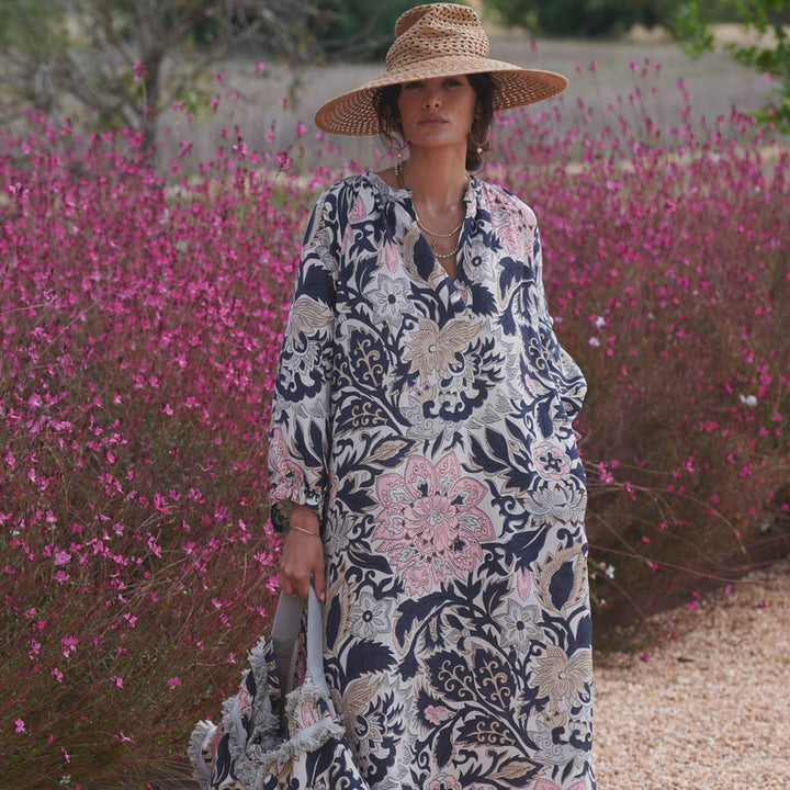 woman wearing black, pink and taupe floral print linen mix raglan dress by One Hundred Stars