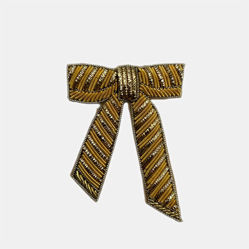 gold beaded bow brooch