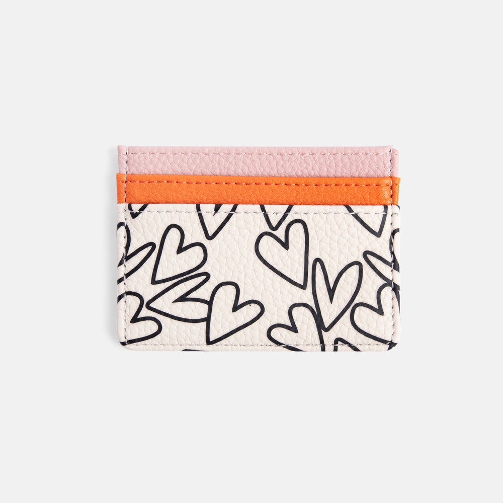 leather look card holder with hearts print design and orange and pink contrast pockets
