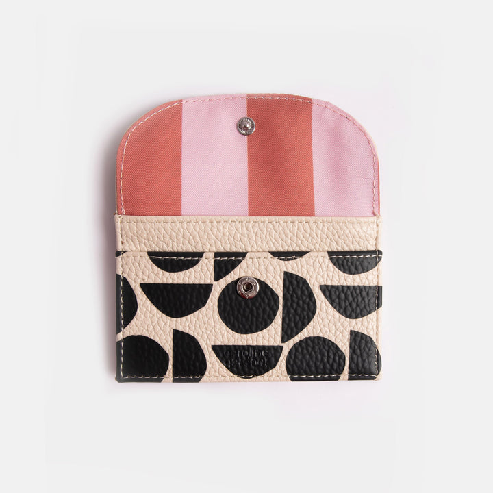 leather look PU card holder coin purse with monochrome abstract geometric shapes design, pink zip pull and pink & orange stripe lining