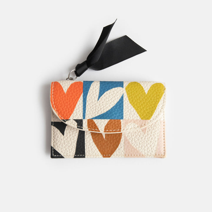 leather look PU card holder coin purse with multicolour hearts design, black zip pull and big monochrome dots lining