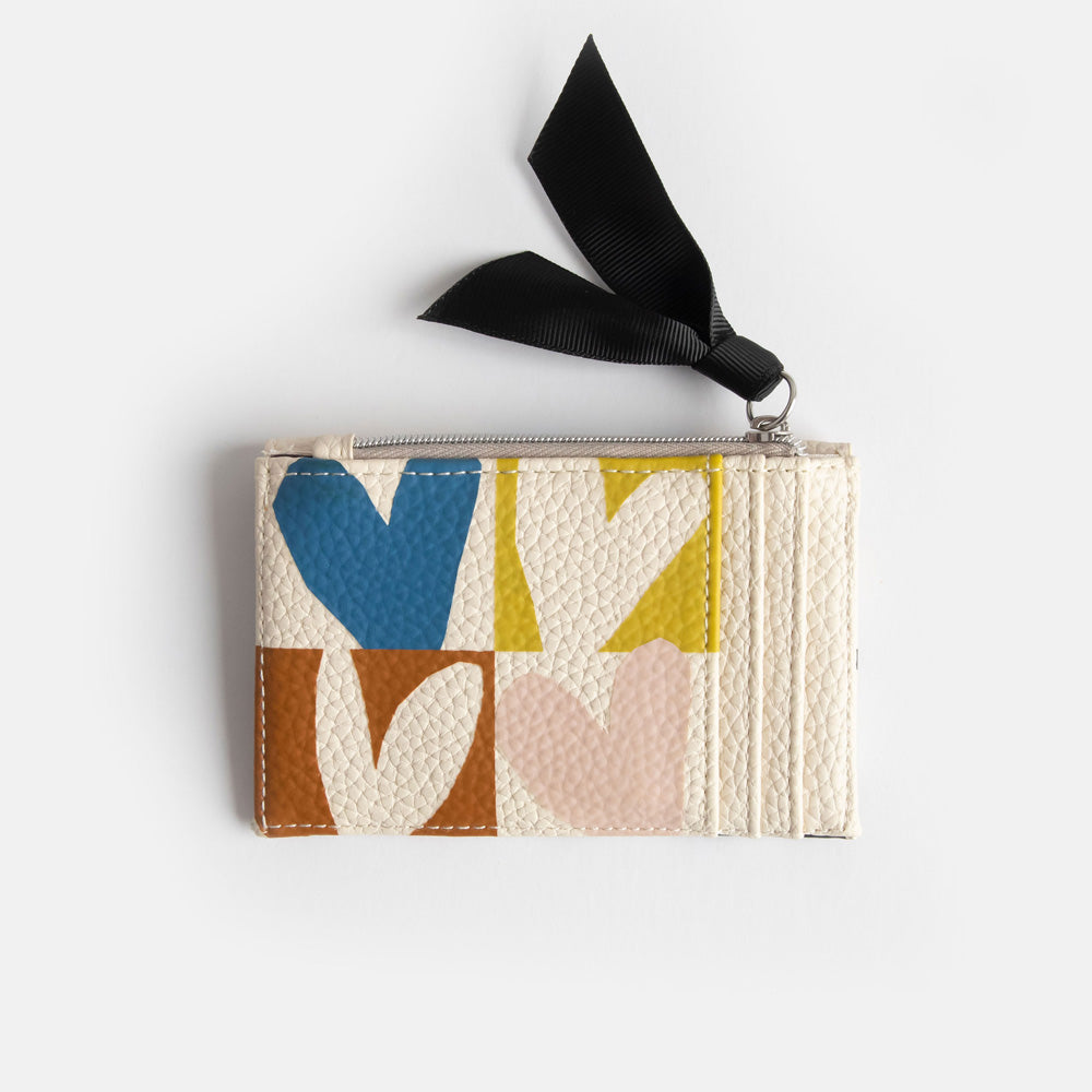 leather look PU card holder coin purse with multicolour hearts design, black zip pull and big monochrome dots lining