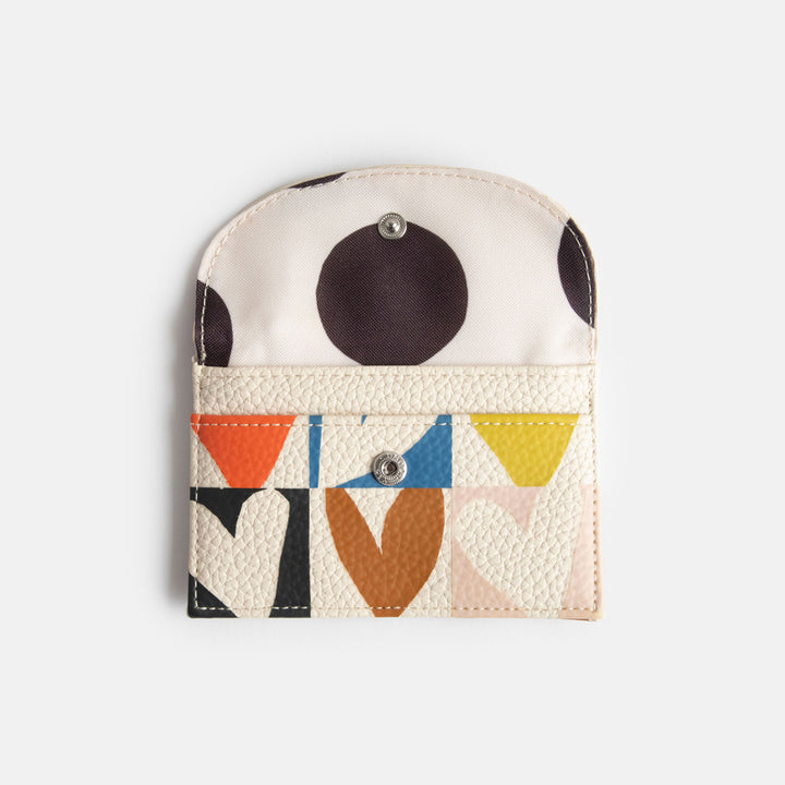 leather look PU card holder coin purse with multicolour hearts design, black zip pull and big monochrome dots lining