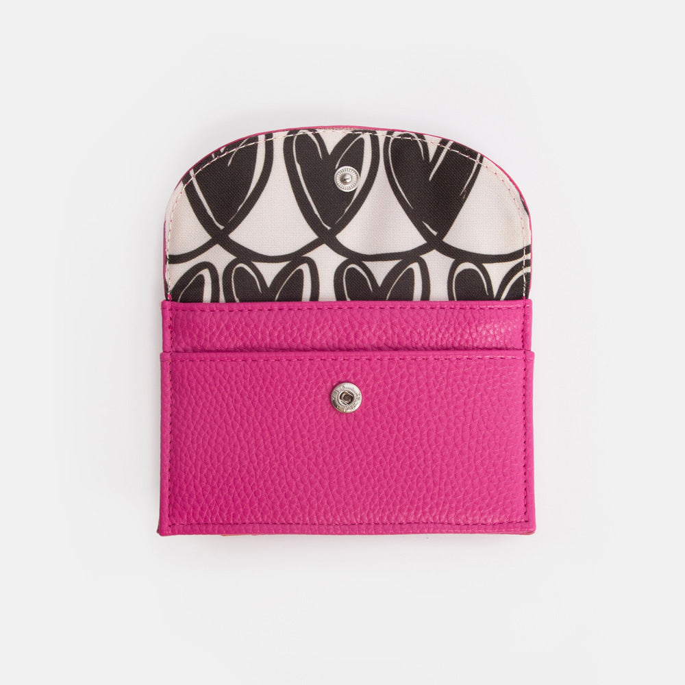 bright pink purse with black & white hearts print lining