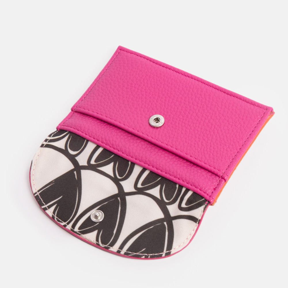 bright pink purse with black & white hearts print lining