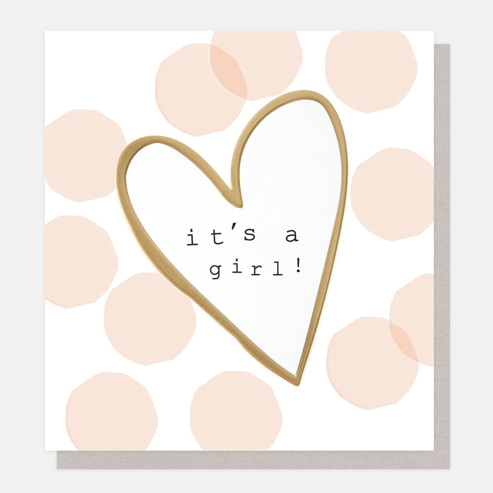 Card with gold heart and 'it's a girl!' text on a polka dot background